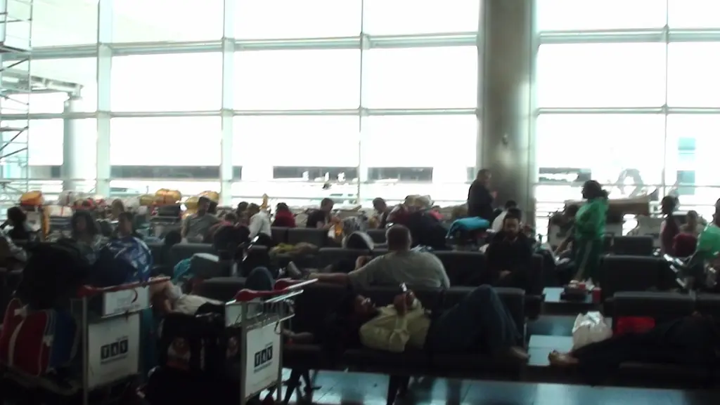 Passengers sleep on the floor of an Istanbul airport on 19 April 2010, stranded while European airspace was closed by the Eyjafjallajökull eruption.